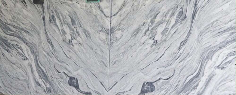 Book-matched grey granite with dark flowing veins