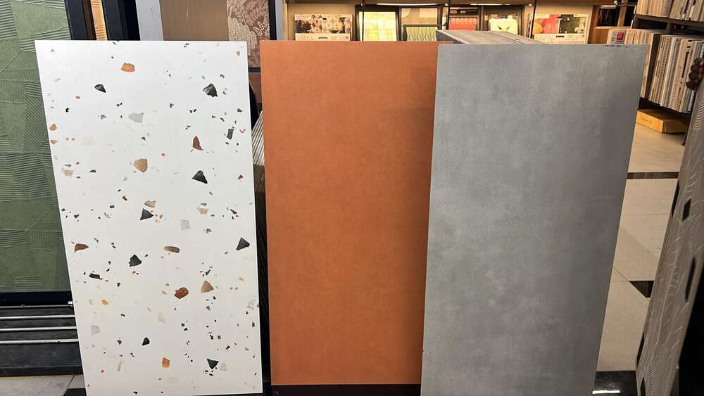 Large-format porcelain tiles standing in a showroom